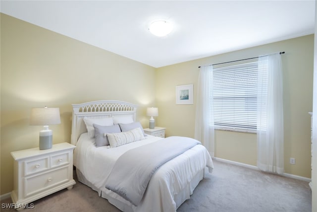 bedroom with light colored carpet