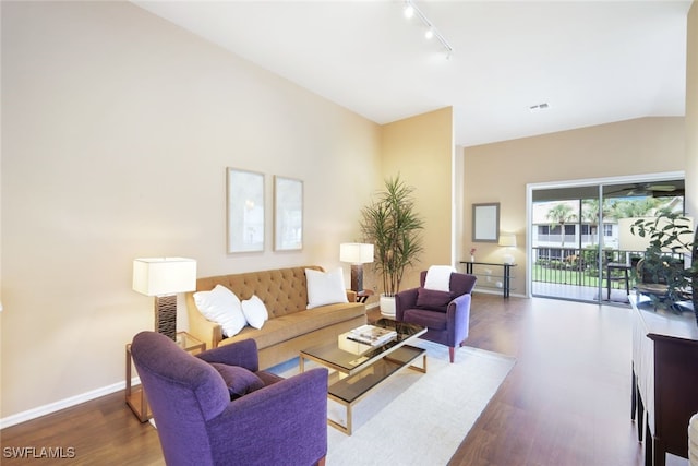 living room with track lighting and dark hardwood / wood-style floors