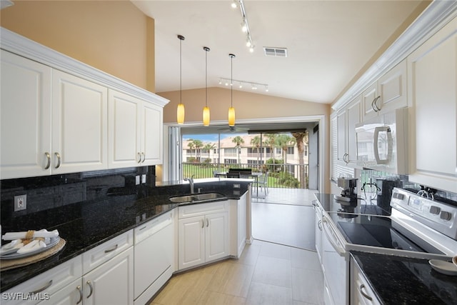 kitchen featuring sink, white cabinets, and white appliances