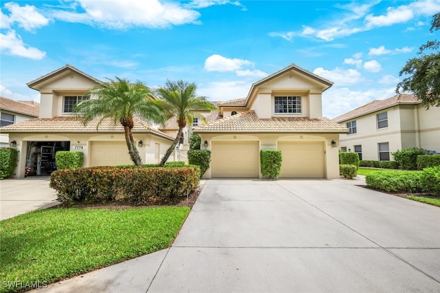 mediterranean / spanish-style house with a garage