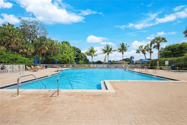 view of swimming pool with a patio