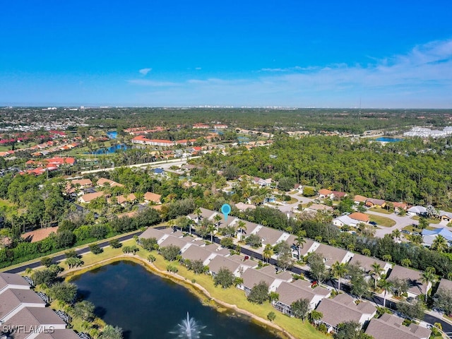 birds eye view of property featuring a water view and a residential view