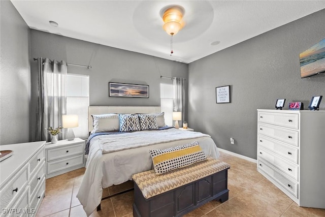 tiled bedroom with ceiling fan