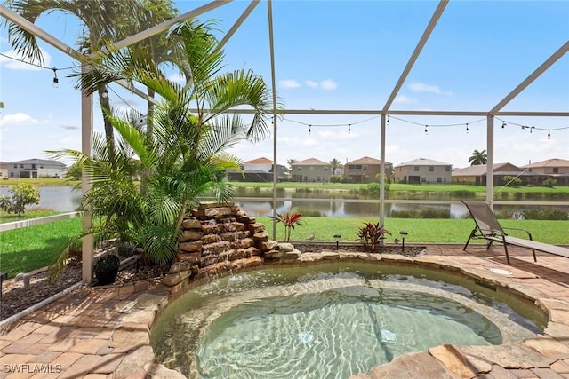 view of swimming pool featuring a hot tub, a water view, and a lanai