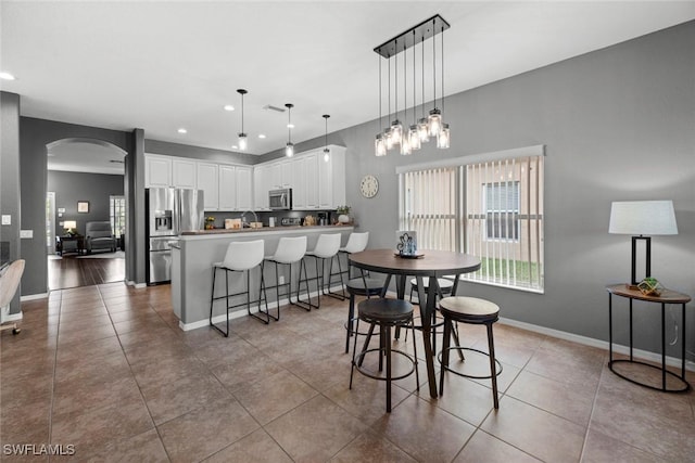 dining area featuring tile patterned floors