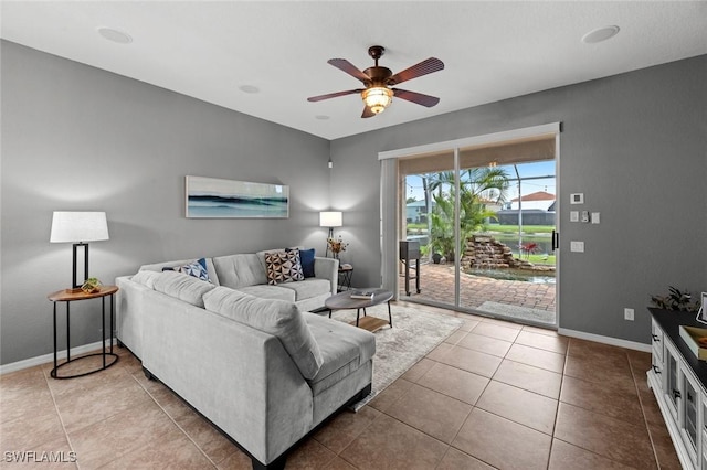 tiled living room with ceiling fan