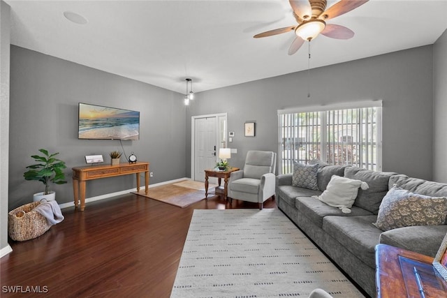 living room with hardwood / wood-style flooring and ceiling fan