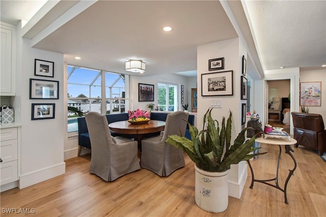 dining space with light wood-type flooring