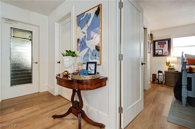 hallway featuring light hardwood / wood-style flooring