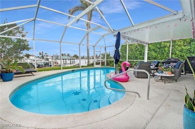 view of swimming pool with a lanai, an outdoor hangout area, and a patio