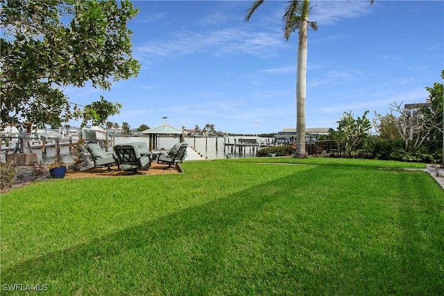 view of yard featuring a dock