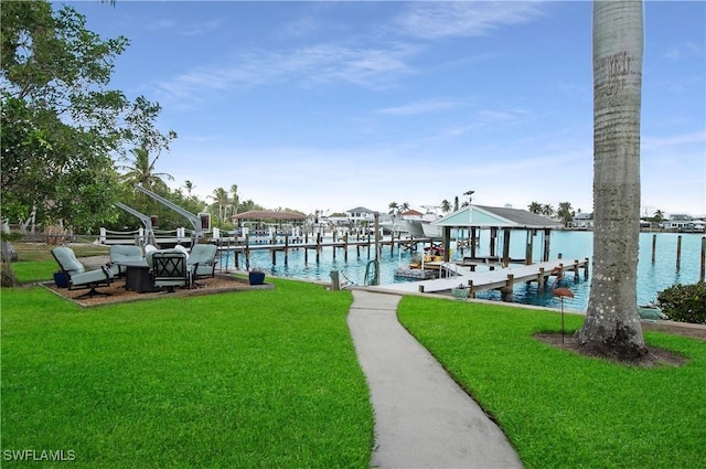 view of dock featuring a water view and a lawn