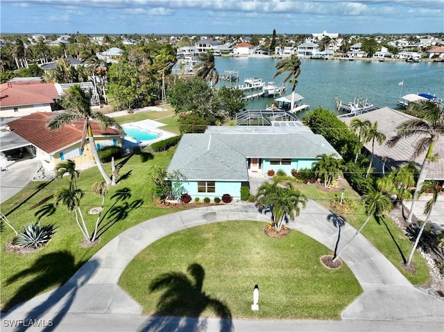 birds eye view of property with a water view