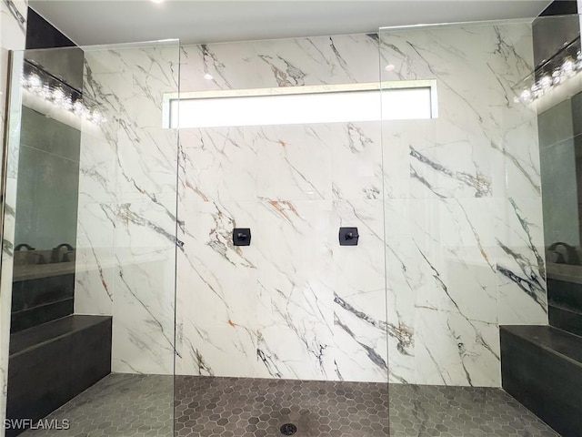 bathroom featuring a tile shower