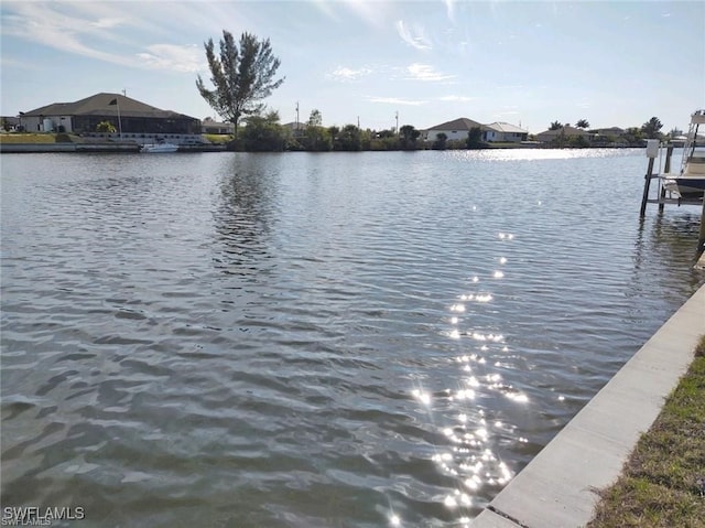 property view of water featuring a boat dock