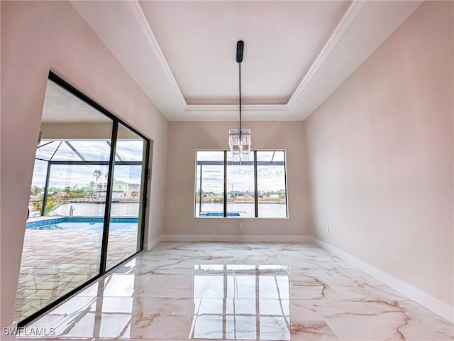 spare room with a raised ceiling