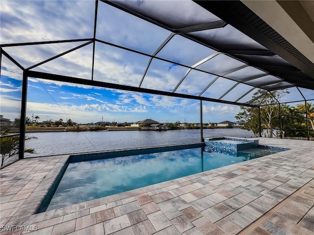 view of pool with a water view, an in ground hot tub, a lanai, and a patio area