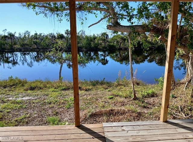 wooden deck with a water view