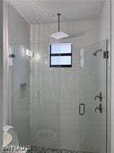 bathroom featuring walk in shower