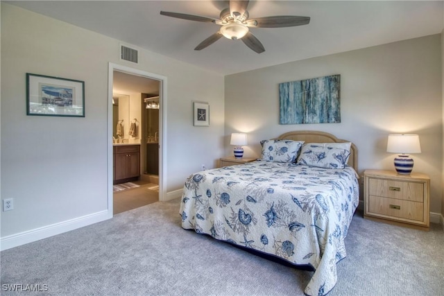 carpeted bedroom featuring ceiling fan and ensuite bathroom