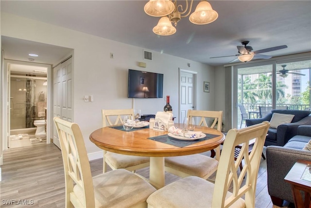 dining space with light hardwood / wood-style flooring