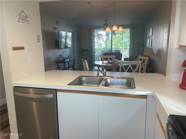 kitchen with dishwasher, sink, kitchen peninsula, and white cabinets