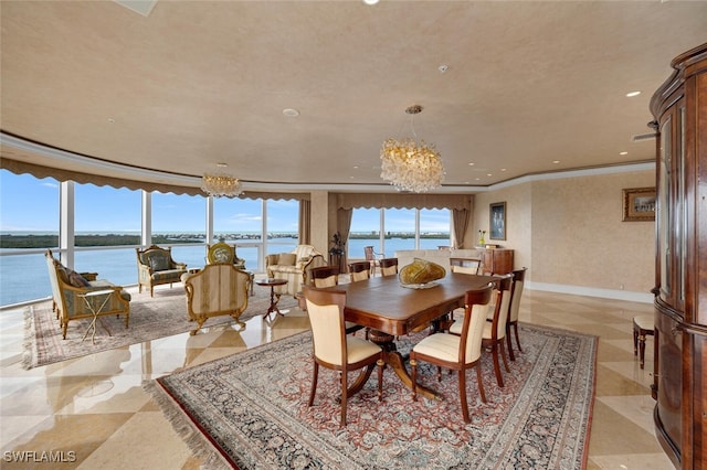 dining area with a water view and a notable chandelier