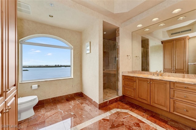 bathroom with a water view, vanity, toilet, and walk in shower