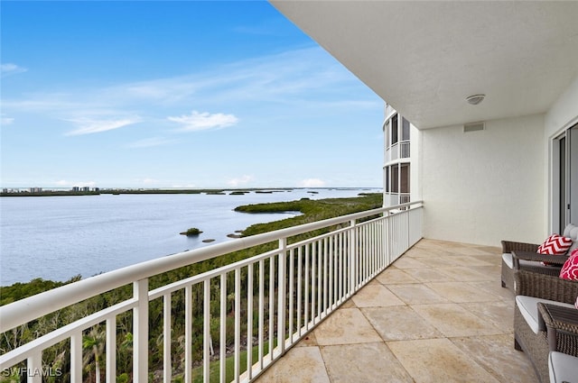 balcony featuring a water view