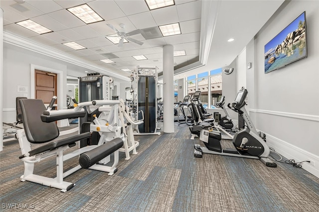 exercise room with a drop ceiling and ceiling fan