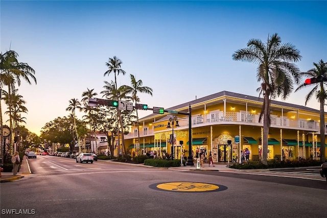 view of outdoor building at dusk