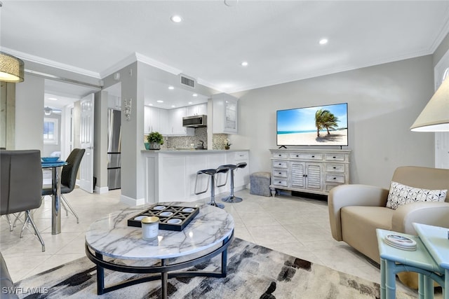 tiled living room with ornamental molding