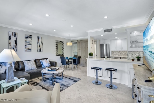 living room featuring crown molding and light tile patterned flooring