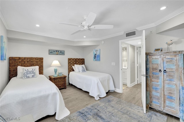 bedroom with light hardwood / wood-style flooring, ornamental molding, and ceiling fan