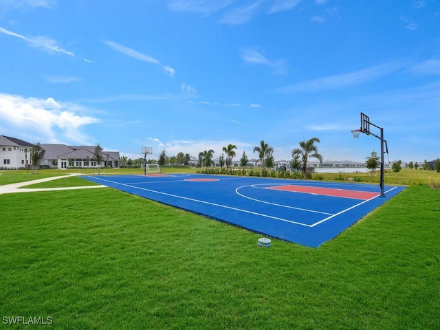 view of basketball court featuring a yard