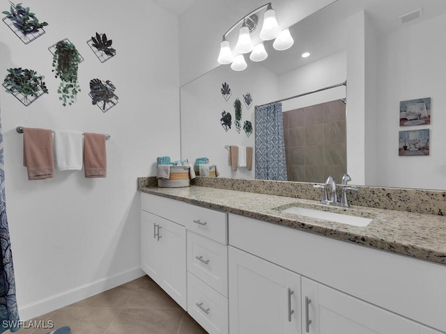 bathroom featuring vanity, a shower with curtain, and tile patterned floors