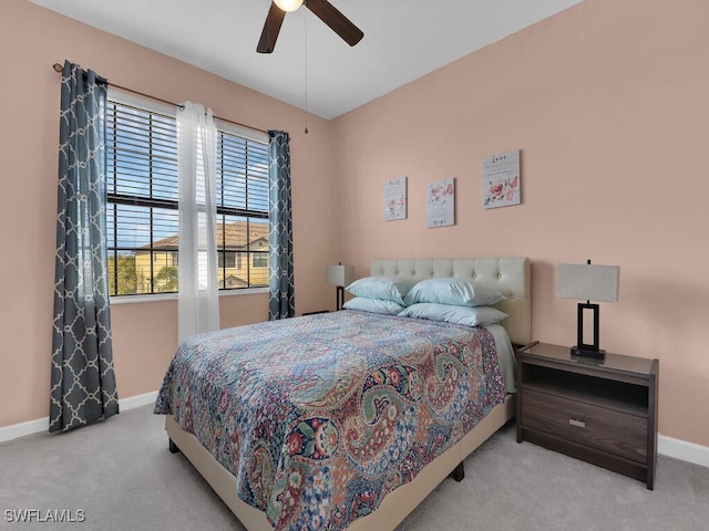 bedroom featuring ceiling fan and light colored carpet