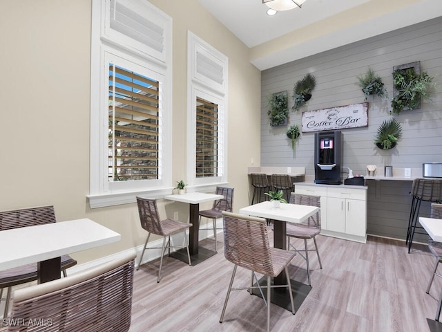 dining space with light hardwood / wood-style flooring