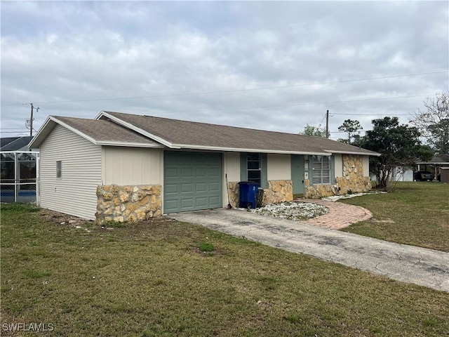 single story home with a garage and a front lawn