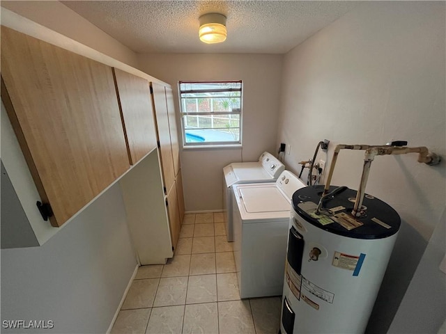 clothes washing area with separate washer and dryer, electric water heater, light tile patterned floors, and a textured ceiling