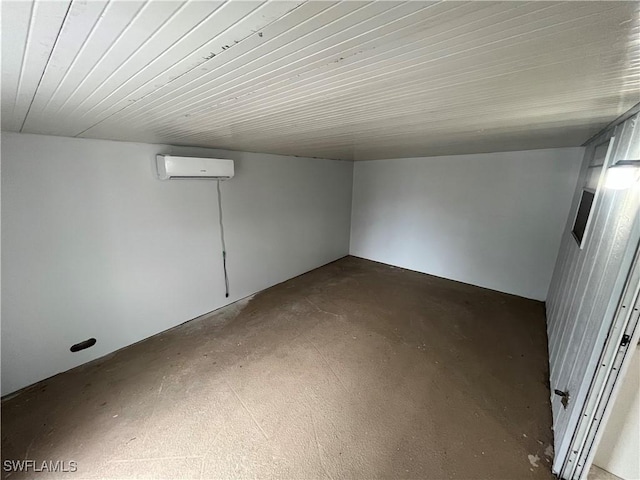 basement featuring a wall mounted AC