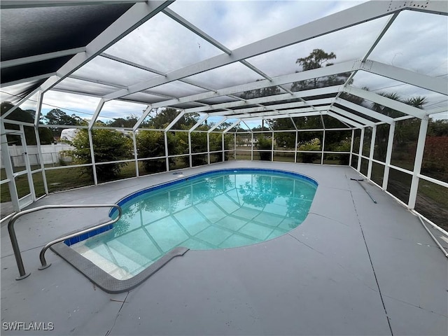 view of pool featuring a lanai and a patio area