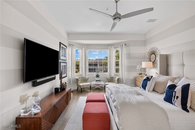 bedroom featuring hardwood / wood-style flooring and ceiling fan