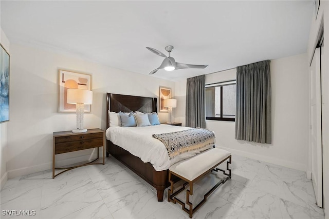 bedroom featuring ceiling fan and a closet