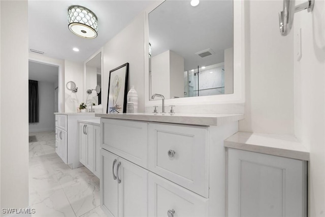 bathroom featuring vanity and a shower