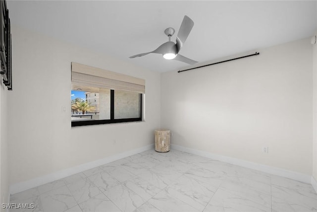 spare room with ceiling fan