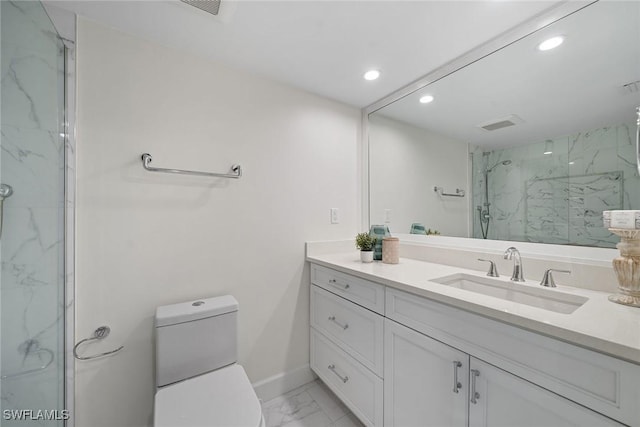 bathroom featuring vanity, walk in shower, and toilet