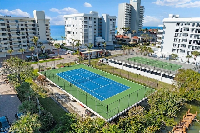 view of sport court featuring a water view