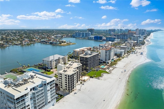 birds eye view of property featuring a view of the beach and a water view