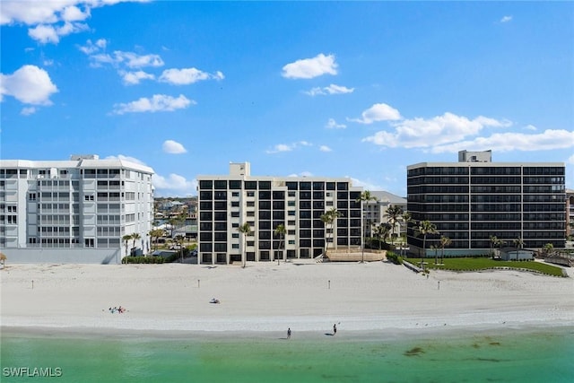 view of property featuring a water view and a view of the beach